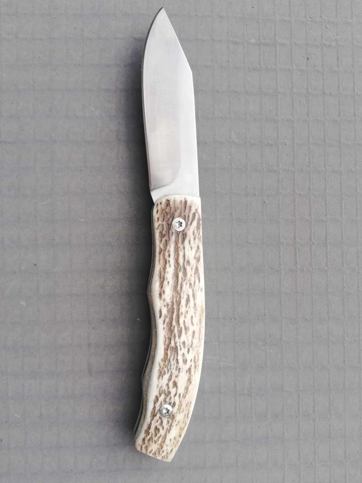 Couteau pliant à cran plat